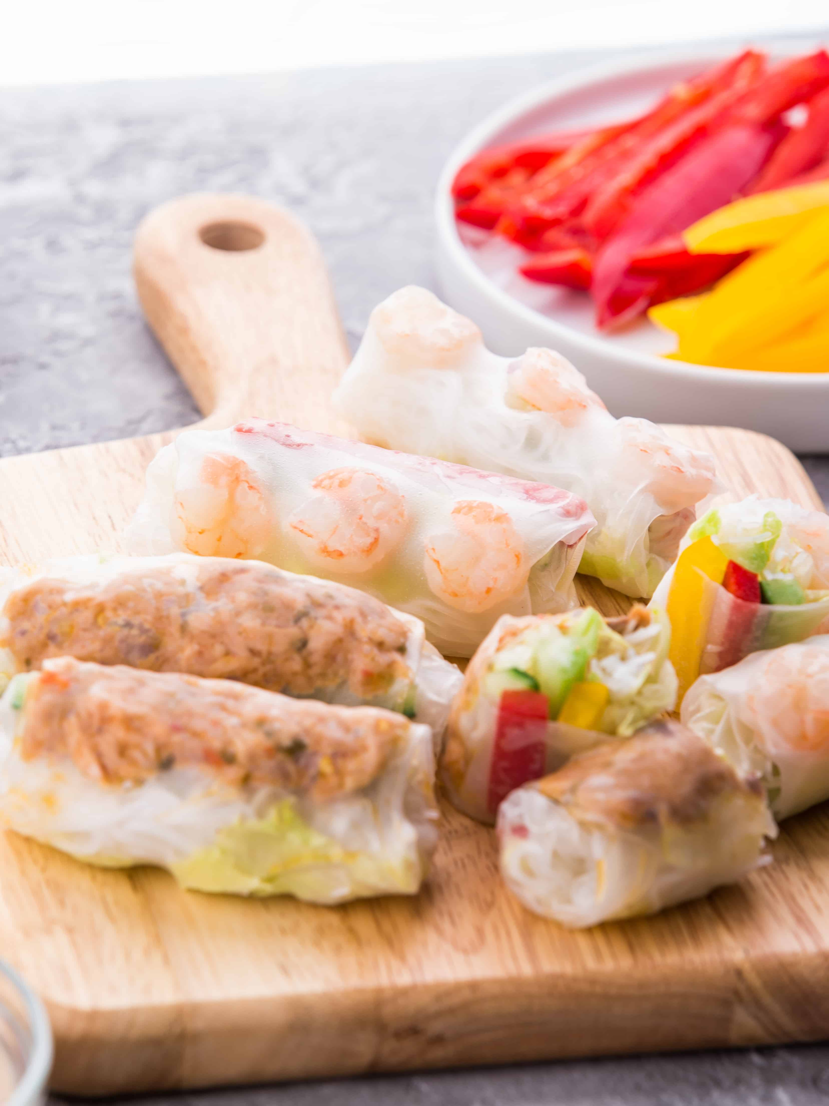 Healthy Shrimp and Spicy Tuna Vietnamese Spring Rolls! Clean and fresh appetizers served with sesame mayo and peanut sauce.