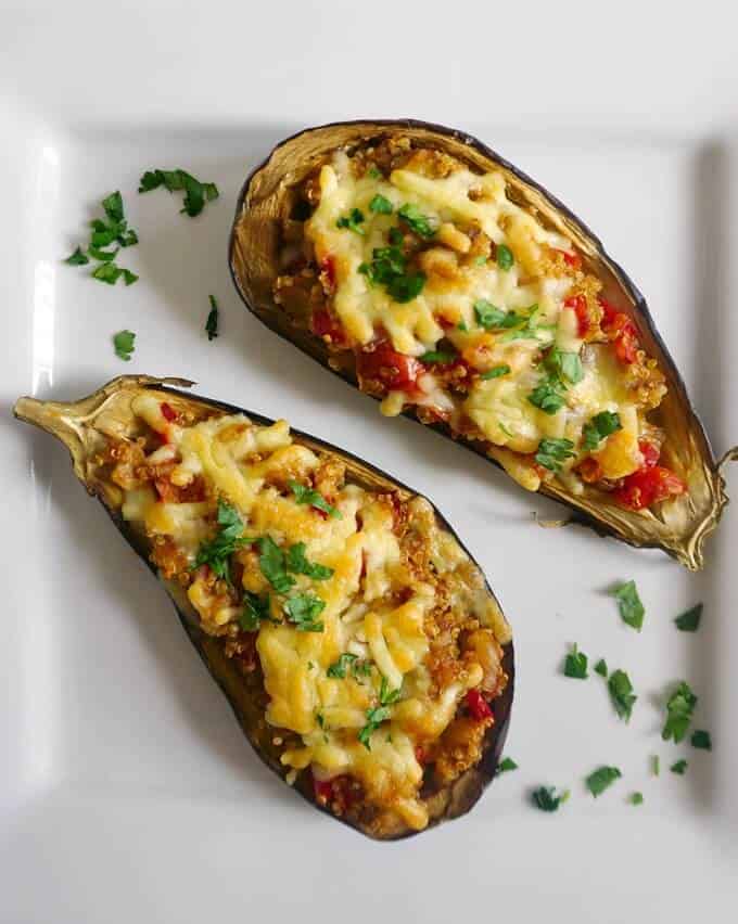 Healthy Quinoa-Stuffed Eggplant, a delicious appetizer that is low carb, low calorie and gluten free. Super simple to make, these stuffed eggplant is a must-try recipe.
