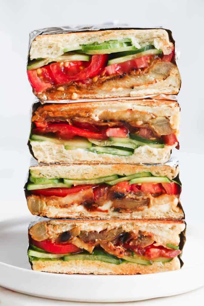 This vegan eggplant sandwich is so delicious that you’ll keep making it over and over again. Layers of smoky and fresh vegetables are packed in panini bread, then toasted till perfection! Ideal for lunchboxes, picnics, and lunches on the go!