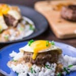 Loco moco is a Hawaiian cuisine made with white rice topped with a hamburger patty, sunny side up egg, and brown beef gravy.