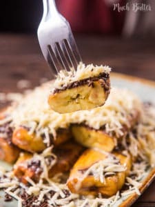 Chocolate cheese fried yellow plantain is an Indonesia dessert/snack. It's topped with chocolate sprinkles, shredded cheddar cheese, and sweetened condensed milk. The sweet and legit taste is very popular among Indonesian people.