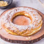 Almond choux pastry ring is a ring-shaped puff pastry filled with vanilla pastry cream and sprinkled with almond. A festive dessert perfect for big days like Christmas and family gatherings.