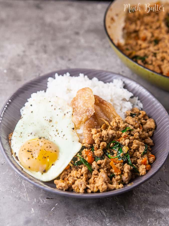 Spicy Thai chicken basil is a flavorful chicken basil stir fry with Thai spices. Sweet, spicy, and savory spices seep into the chicken pieces mix with Thai Basil. Complete it with the warm rice and crispy yolk fried egg on top. It's a quick and easy stir fry that's super delicious!