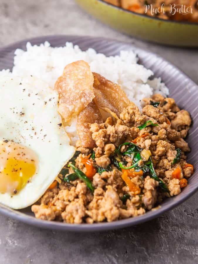 Spicy Thai chicken basil is a flavorful chicken basil stir fry with Thai spices. Sweet, spicy, and savory spices seep into the chicken pieces mix with Thai Basil. Complete it with the warm rice and crispy yolk fried egg on top. It's a quick and easy stir fry that's super delicious!
