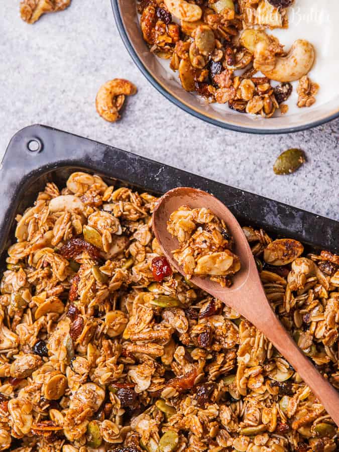 Homemade fruits and nuts granola is healthy snack and breakfast consist of dates honey, granola,seeds, nuts, and dried food. Perfect for diet snack! 