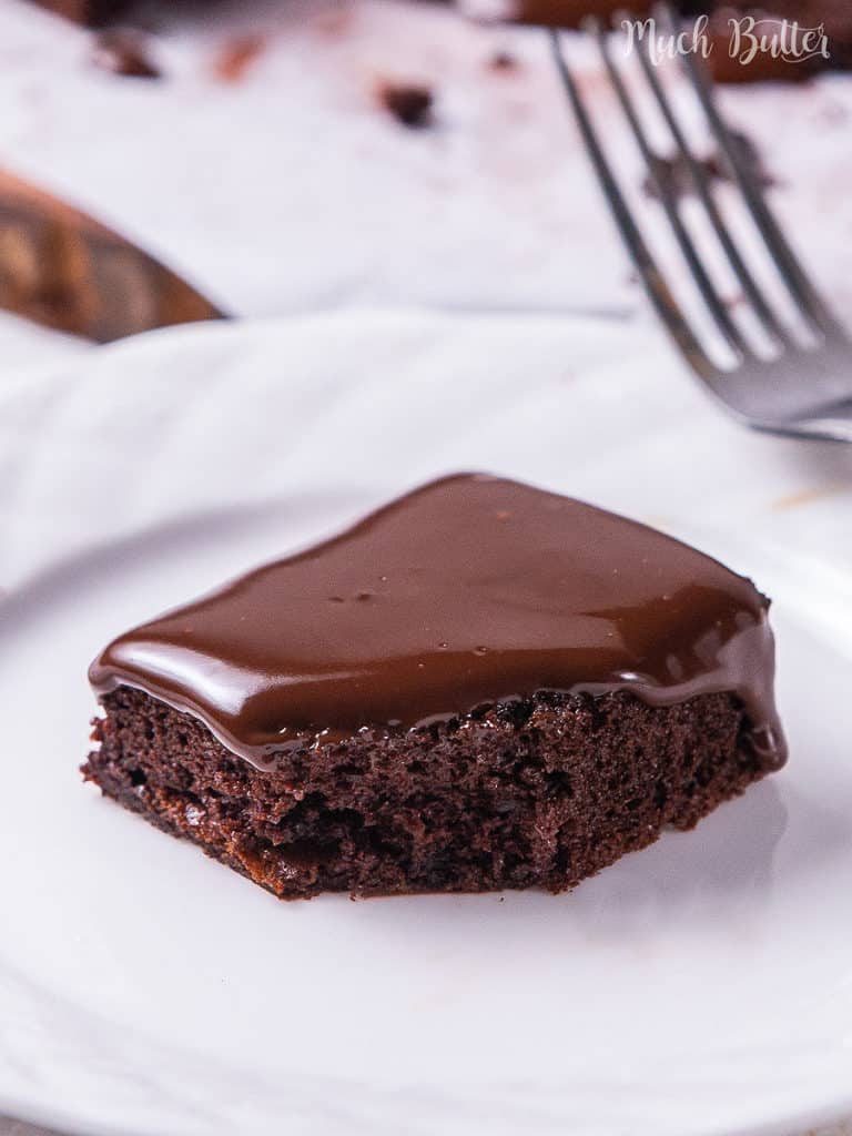 Easy Chocolate Cake with Ganache Frosting is the best moist and fudgy cake for the chocolate lover! Smothered with a creamy chocolate ganache, this fancy and simple cake can be an entertaining dessert even for special days.