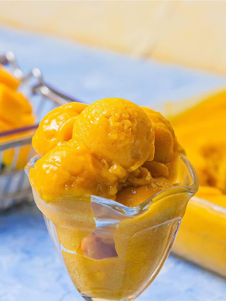 No-Churn Mango Sorbet is a great dessert for your holiday summer or tropical season. It’s fresh, frosty, and healthy because of diary-free