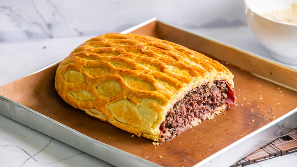 Ground beef wellington, an exquisite dish made from filet beef wrapped with pâté and puff pastry. A perfect menu for a tasteful dinner or celebration.