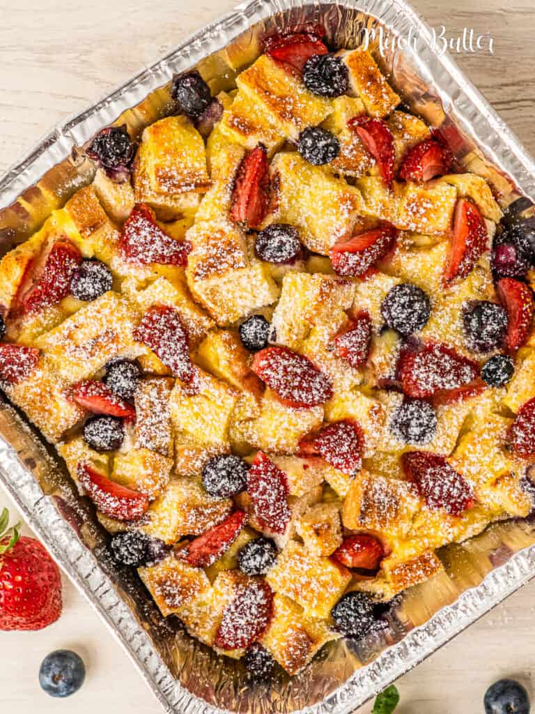 Baked Berry French Toast is always my favorite brunch on a slow weekend. crusty and hearty bread, fresh-picked berries, pst it's really filling