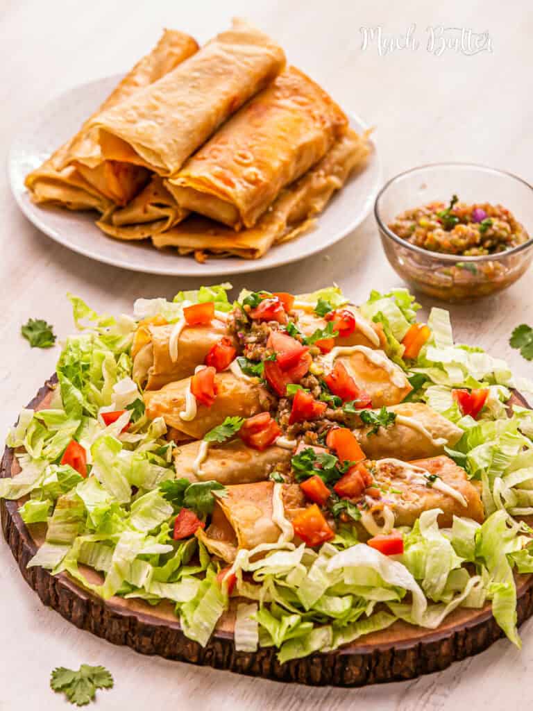 Chicken Chimichangas: A Tex-Mex food with seasoned chicken, gooey cheese, zesty salsa sauce, all wrapped in tortilla deep fried