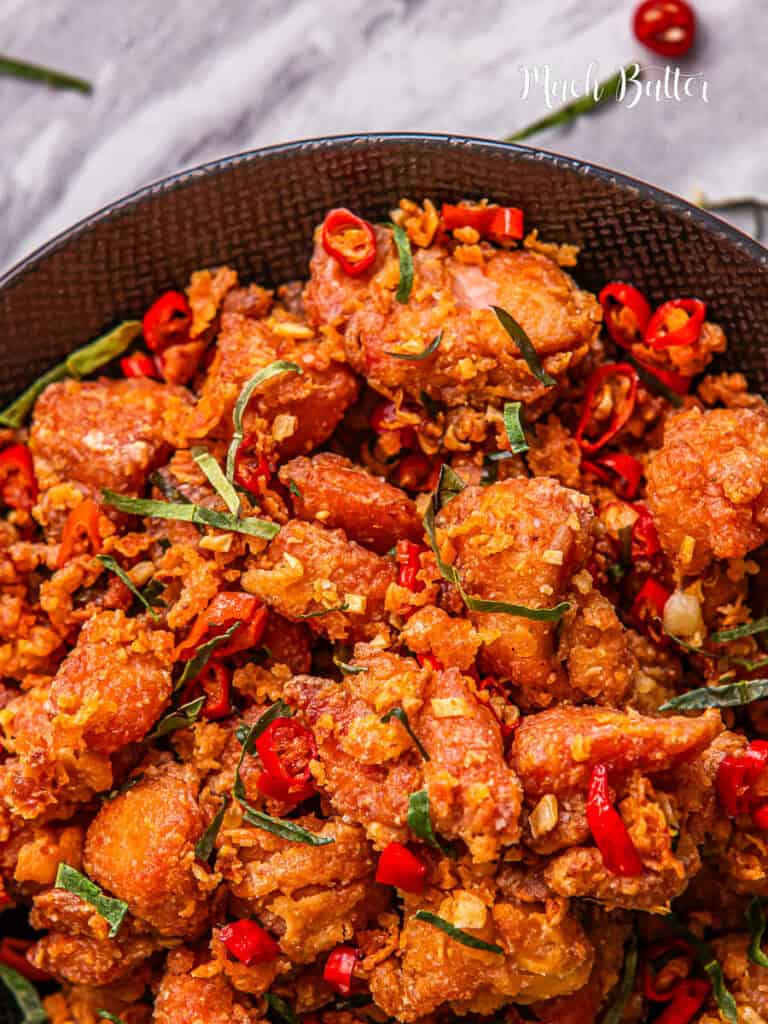 Make this easy Salt and Pepper Chicken dish at home, crispy seasoned chicken, fried up with aromatics garlic, and spicy chilies. 