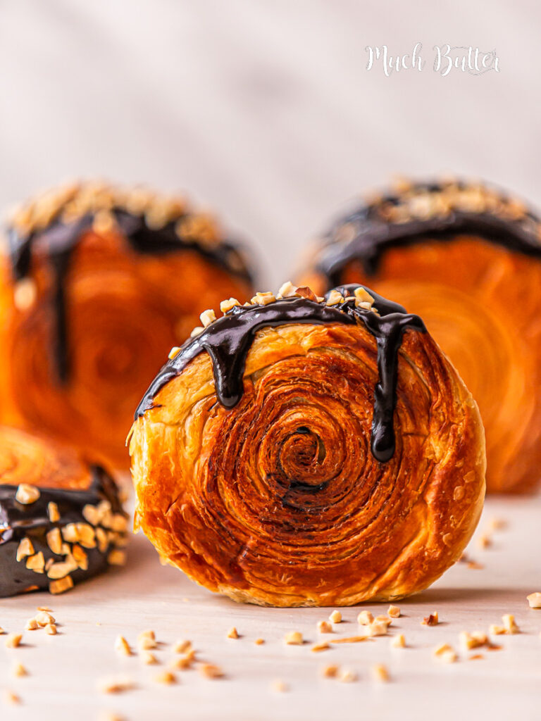  This New York Roll a.k.a Supreme Roll is A circular croissant with Danish pastry, filled with Chocolate cream and topped with a chocolate ganache and chopped nuts. 