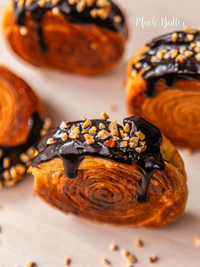  This New York Roll a.k.a Supreme Roll is A circular croissant with Danish pastry, filled with Chocolate cream and topped with a chocolate ganache and chopped nuts. 
