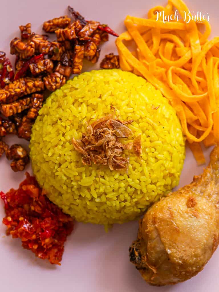 Make an authentic Indonesian Yellow Rice a.k.a nasi kuning with a rice cooker! This yummy rice is cooked in coconut milk, turmeric, and herbs