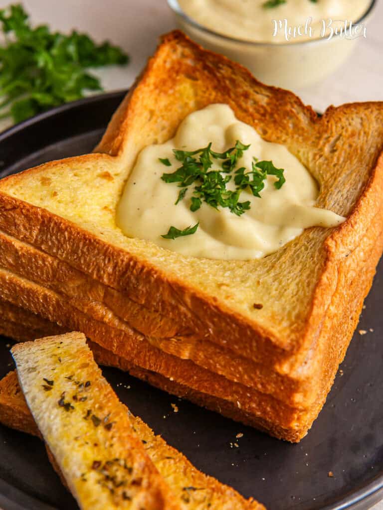 Discover our Halal cheese fondue with a bread, a modern take on a classic favorite, creating a luxurious dip that's ideal for sharing.