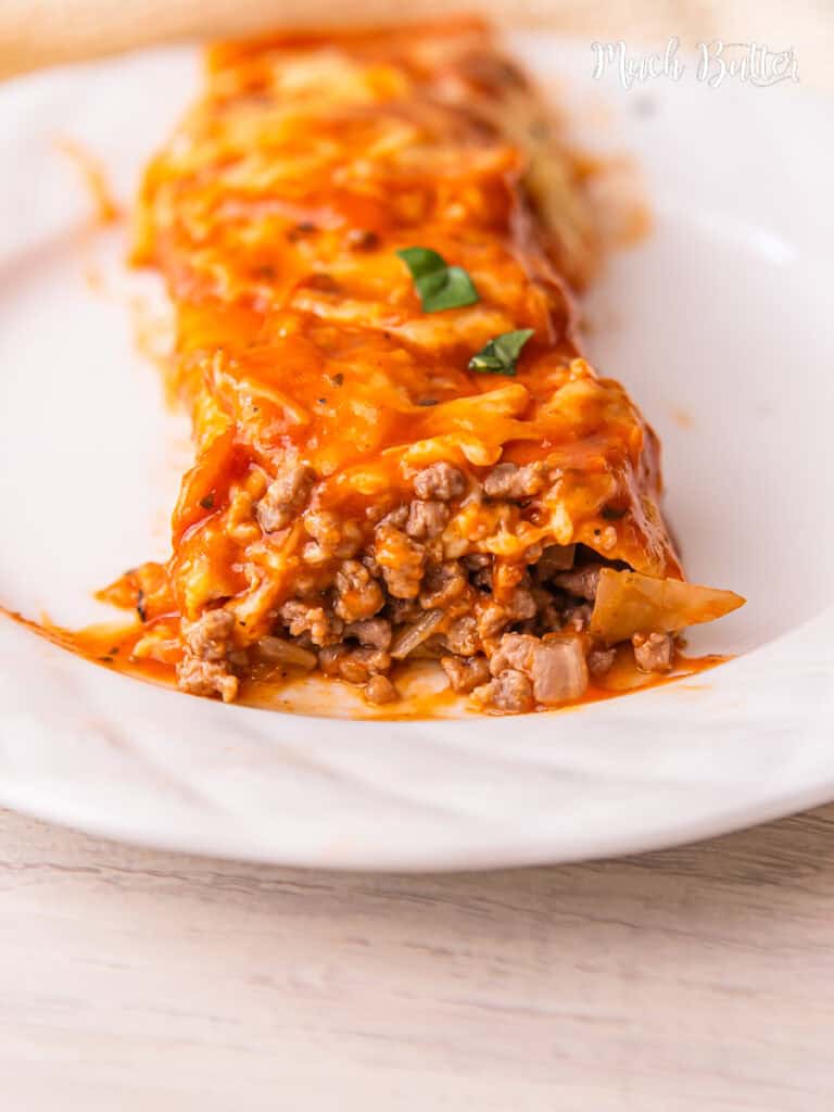 These Easy Beef Enchiladas recipe are made with a flavorful ground beef, soft tortillas, cheese, and all smothered in enchilada sauce 
