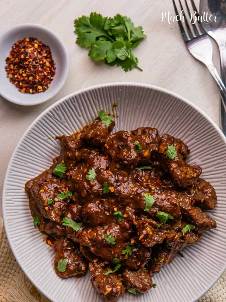 Beef Vindaloo is famous for its distinctive spicy and sour taste, which comes from a combination of spices and vinegar.