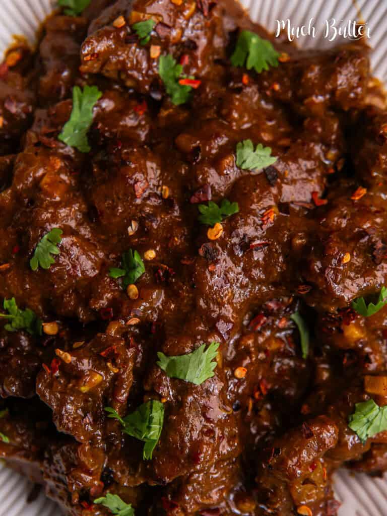 Beef Vindaloo is famous for its distinctive spicy and sour taste, which comes from a combination of spices and vinegar.