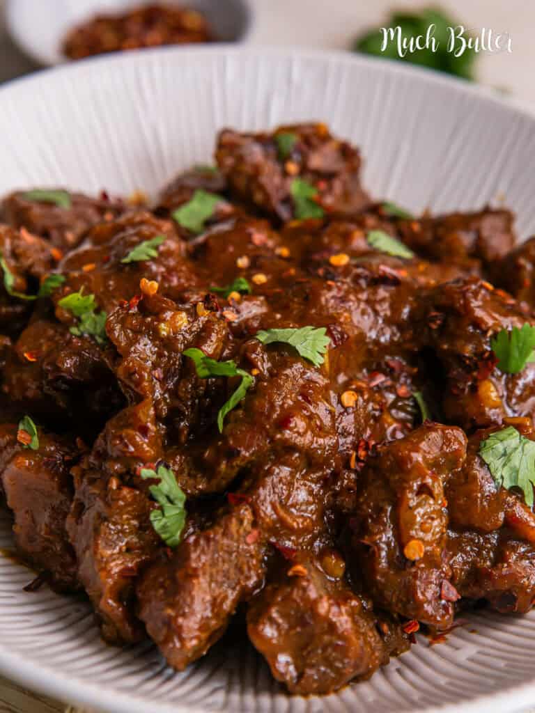 Beef Vindaloo is famous for its distinctive spicy and sour taste, which comes from a combination of spices and vinegar.