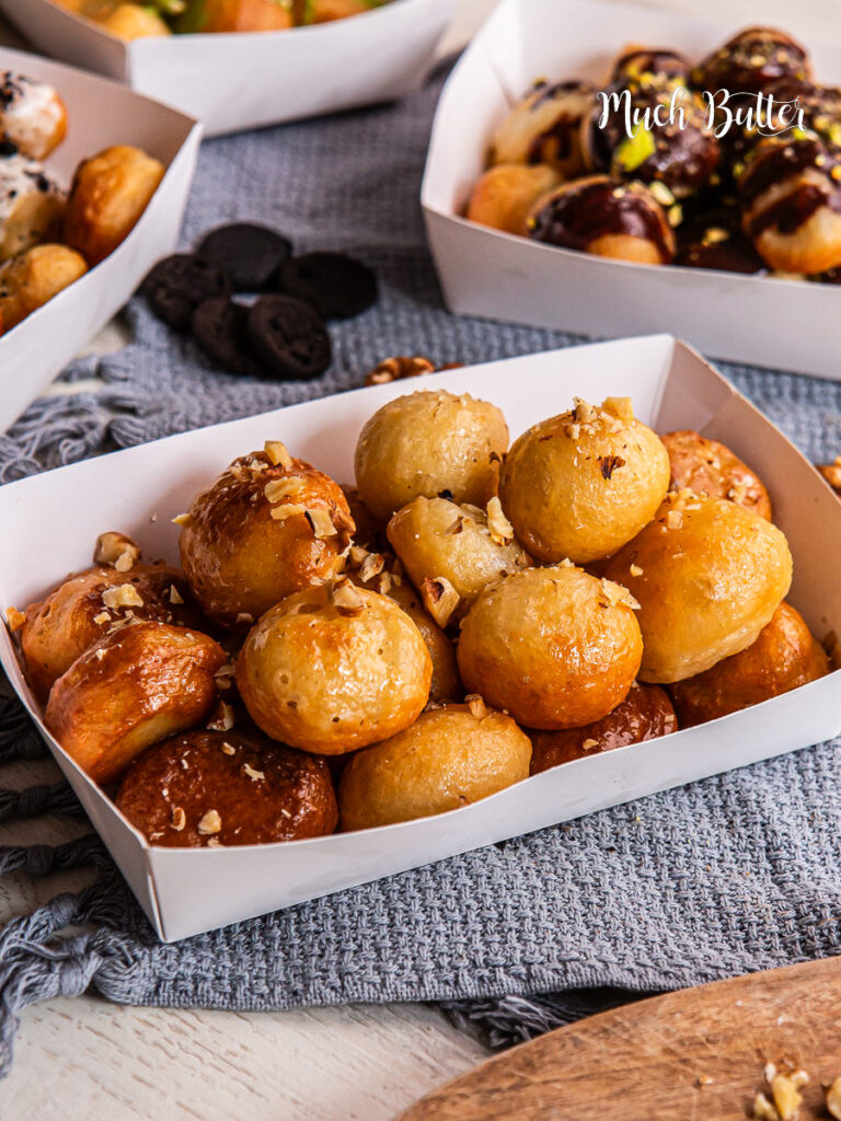 Try Loukoumades, A Greek bite-size donut with crispy on the outside, fluffy on the inside, and soaked in sweet honey syrup.