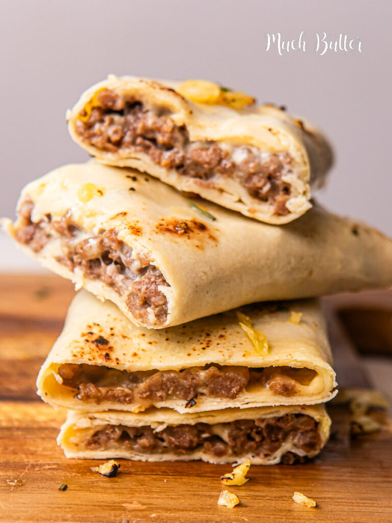 A fun twist on bunless cheeseburgers with this Garlic Butter Cheeseburger Roll Up! Made with ground beef, gooey melted combo cheese inside a tortilla wrap!