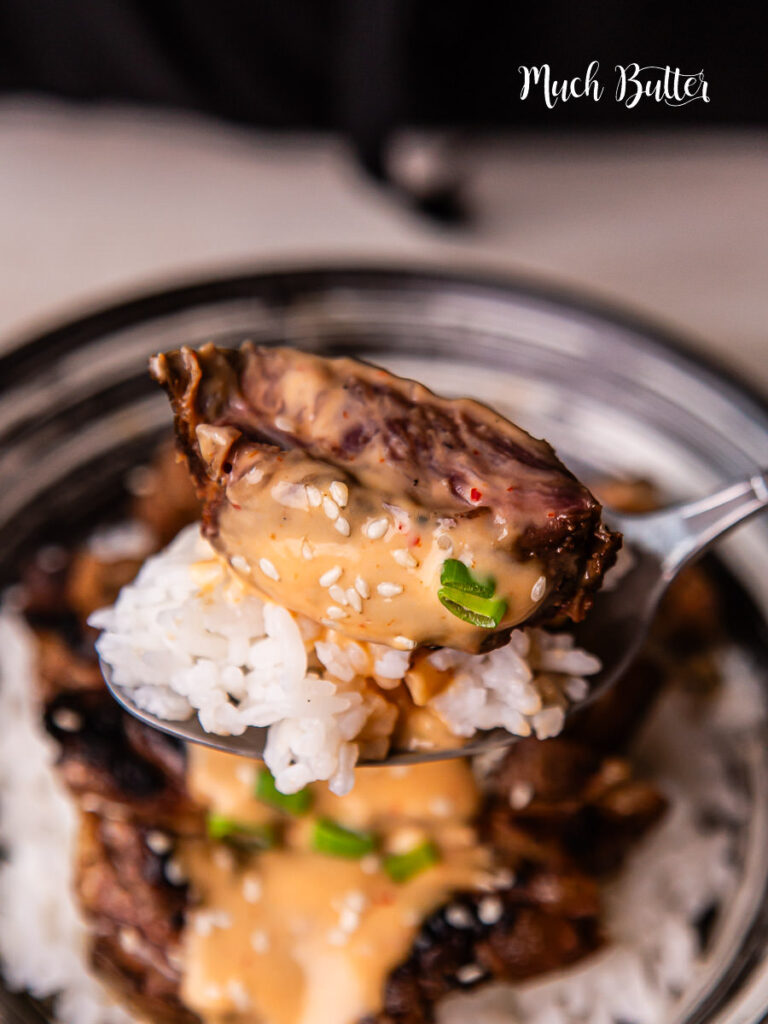 Korean BBQ steak rice bowl with creamy sauce is bold, savory, and incredibly satisfying. Tender slices of marinated steak are pan-seared to perfection!