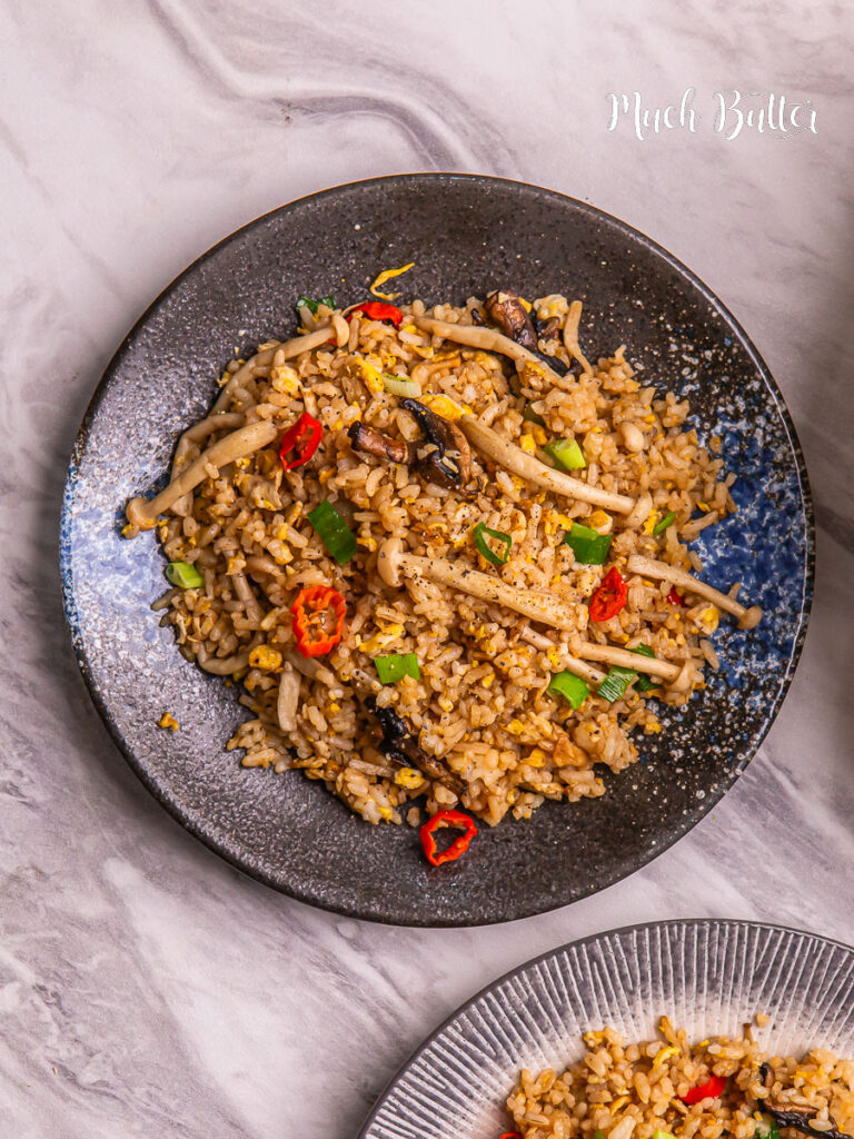 This Mushroom Fried Rice is quick, garlicky, and full of umami flavor. Made with day-old rice, soy sauce, and buttery shimeji mushrooms.